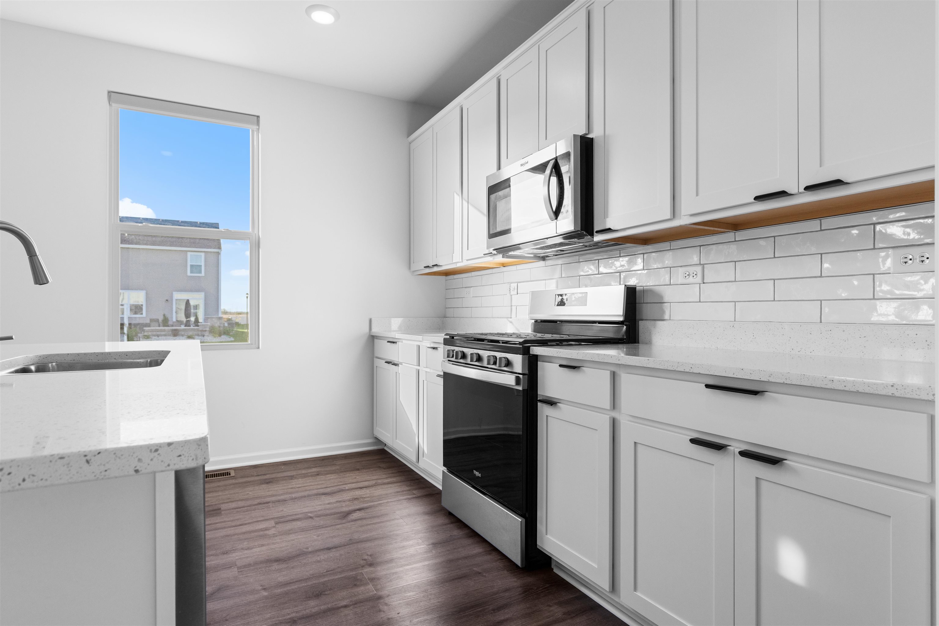 9981 Humbolt Avenue Huntley, IL 60142 - Photo 5 of 23 a kitchen with stainless steel appliances granite countertop white cabinets a sink and dishwasher