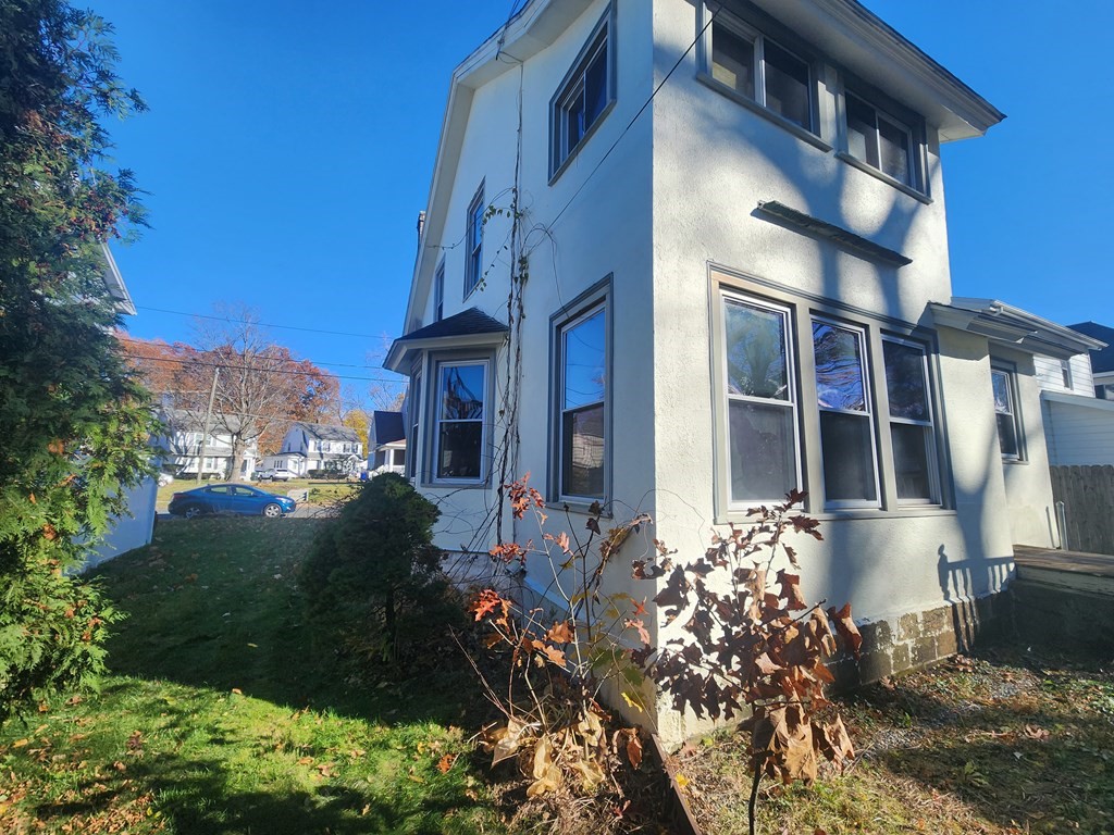 18 Brunswick Street Springfield, MA 01108 - Photo 2 of 23 a front view of a house with a yard