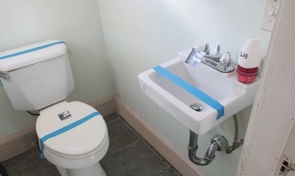 18 Brunswick Street Springfield, MA 01108 - Photo 8 of 23 a bathroom with a toilet and a sink