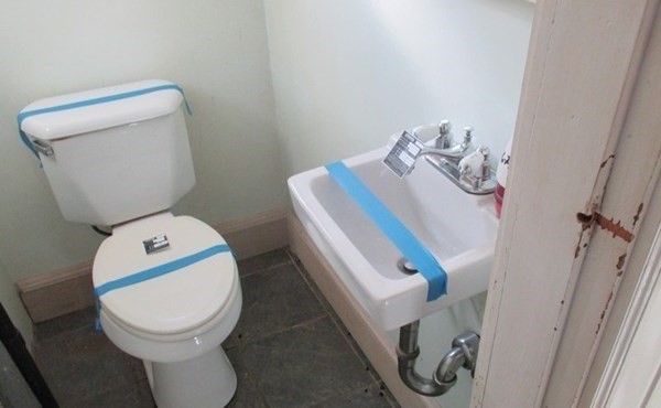 18 Brunswick Street Springfield, MA 01108 - Photo 9 of 23 a bathroom with a toilet and a mirror