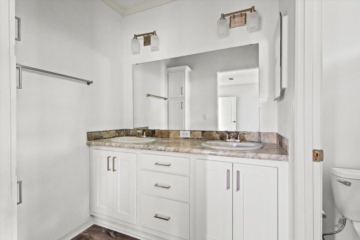 805 Ave B Fort Pierce, FL 34950 - Photo 12 of 29 a bathroom with a granite countertop sink and a mirror