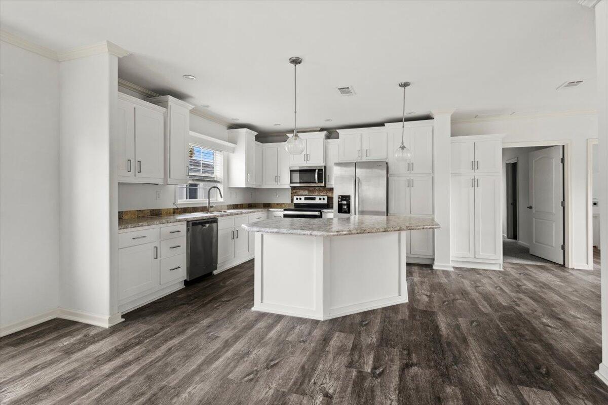 805 Ave B Fort Pierce, FL 34950 - Photo 2 of 29 a kitchen with granite countertop a white stove top oven and cabinets