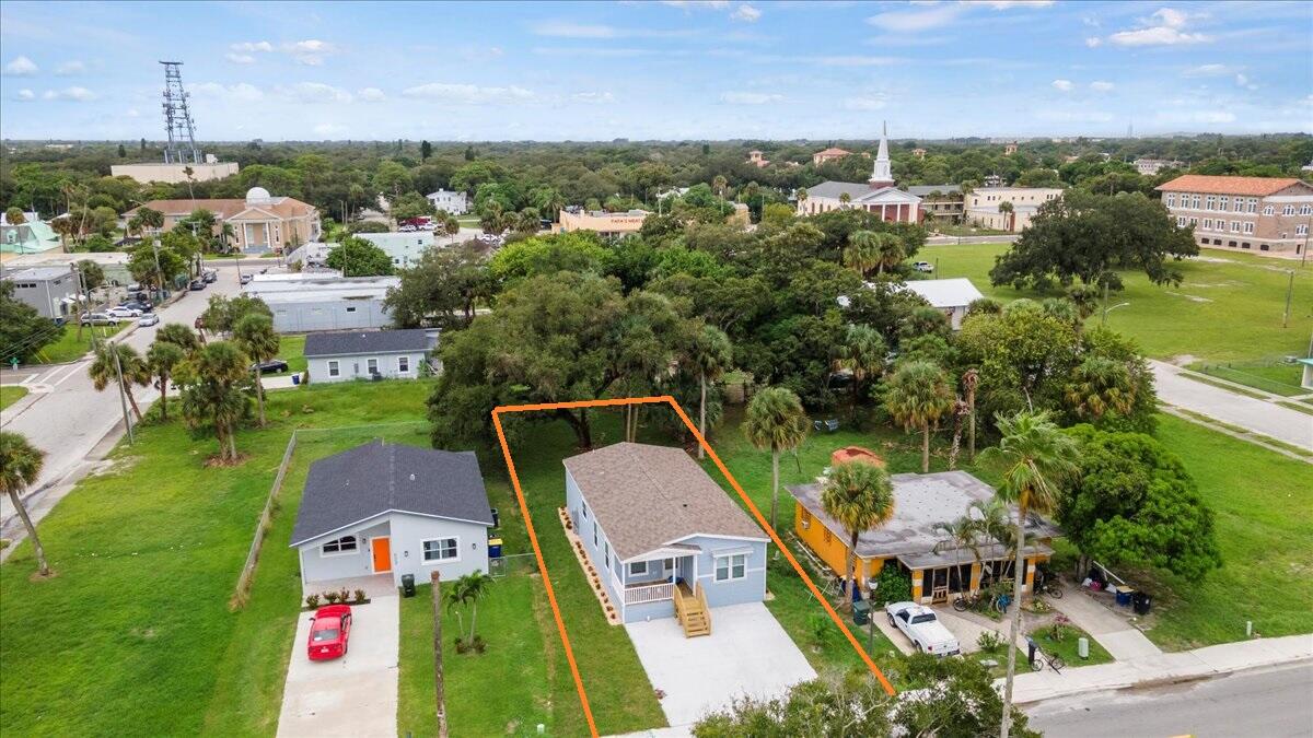 805 Ave B Fort Pierce, FL 34950 - Photo 5 of 29 an aerial view of a house with a garden