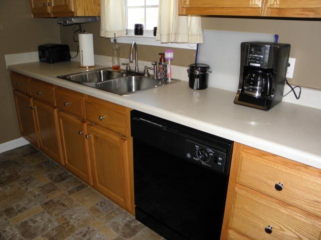 417 Blackey Bandy Road Bethpage, TN 37022 - Photo 6 of 20 Nice clean galley kitchen with oak cabinets.