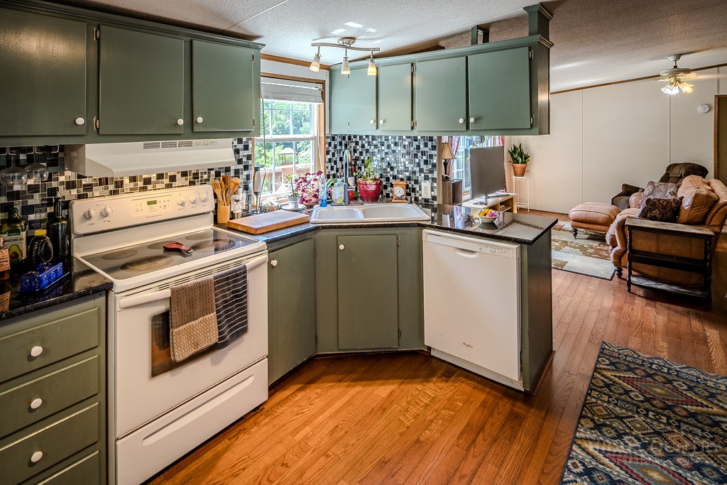461 Reuben Wooten Road Banner Elk, NC 28604 - Photo 15 of 39 a kitchen with a stove and a sink