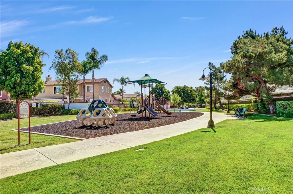11499 Bridgeway Drive Riverside, CA 92505 - Photo 64 of 70 a view of a park with potted plants and a bench