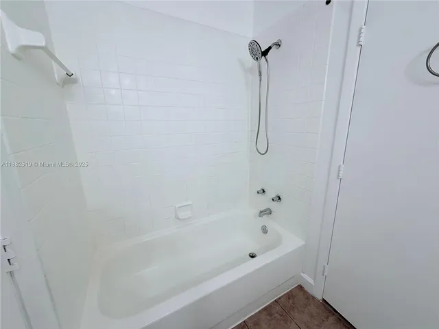 a bathroom with a bath tub and a shower