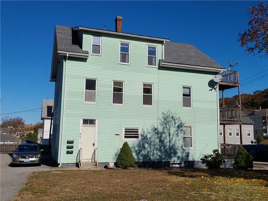 85 Transit Street Woonsocket, RI 02895 - Photo 3 of 14 Different view of side yard and rear entry door
