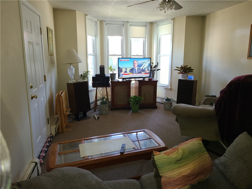 85 Transit Street Woonsocket, RI 02895 - Photo 8 of 14 View from dining room to spacious living room