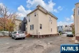 a view of a cars park in front of house