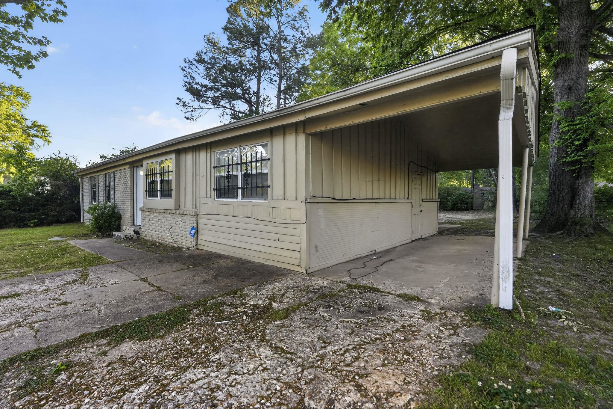 4504 Neely Road Memphis, TN 38109 - Photo 7 of 32 a view of a house with a yard