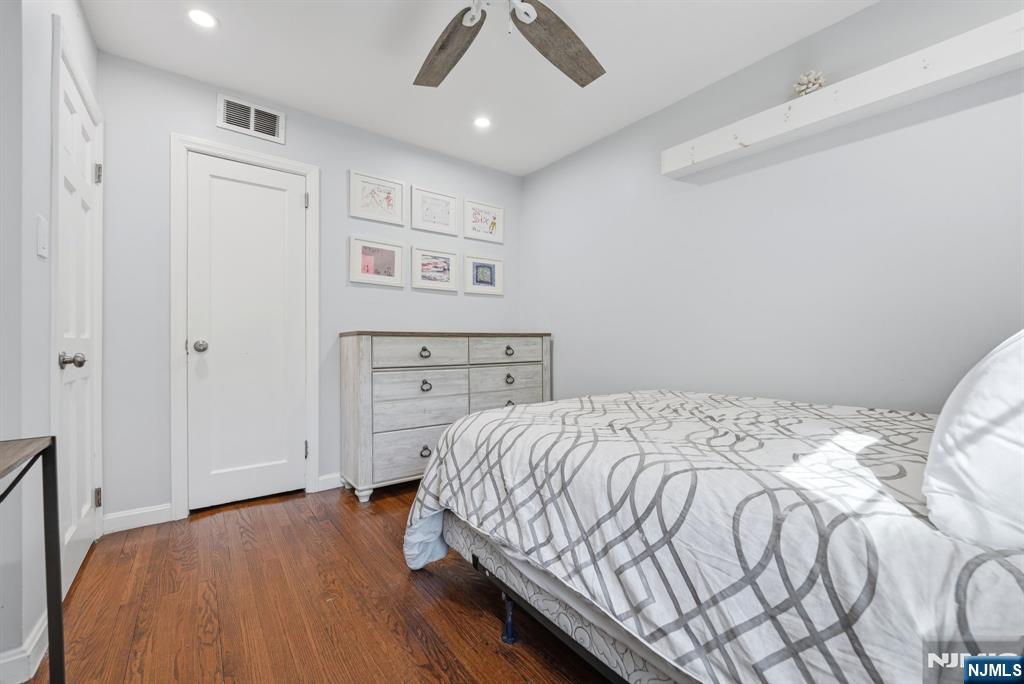 44 Alpine Place Kearny, NJ 07032 - Photo 29 of 50 a bedroom with a bed and a dresser