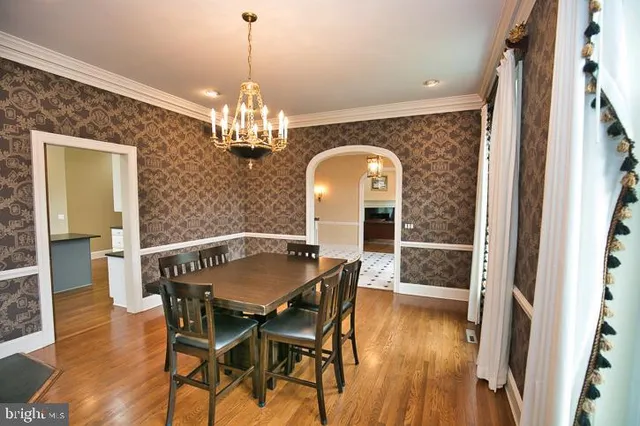 a bed room with a bed and a chandelier