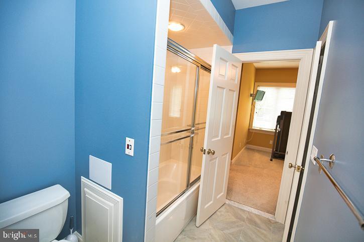 712 Riverside Pines Court Salisbury, MD 21801 - Photo 60 of 94 a bathroom with a granite countertop sink toilet and shower