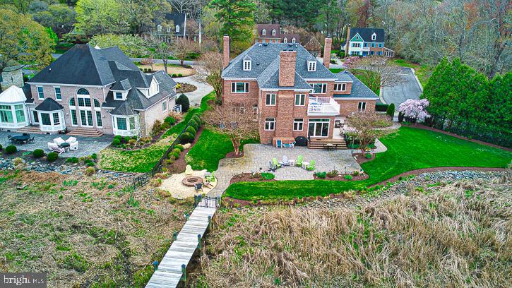 712 Riverside Pines Court Salisbury, MD 21801 - Photo 7 of 94 a aerial view of a house with a yard and lake view