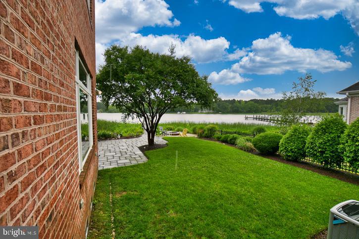 712 Riverside Pines Court Salisbury, MD 21801 - Photo 73 of 94 a view of a garden with a lake