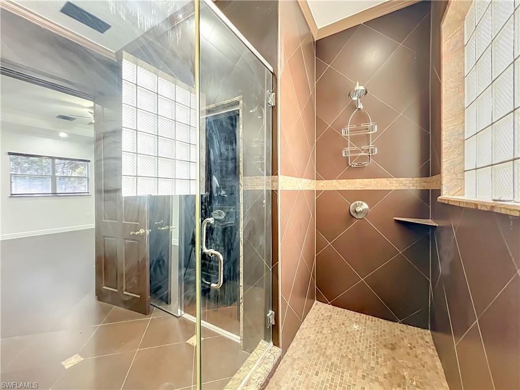 4210 South Hiawassee Road Orlando, FL 32835 - Photo 27 of 49 a bathroom with a shower and a sink