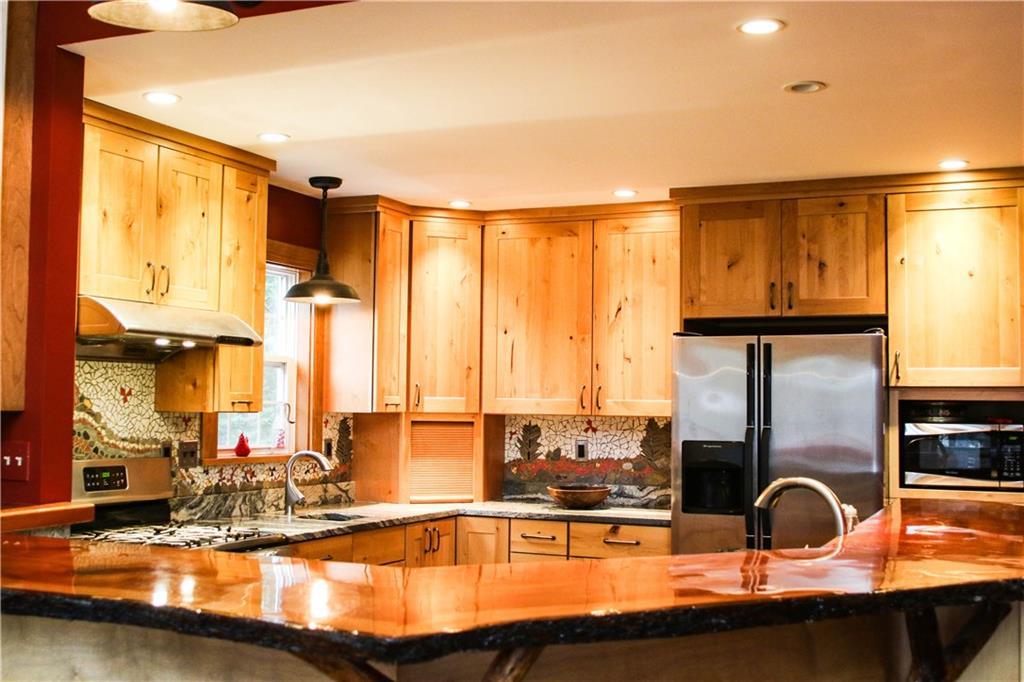 Custom created kitchen with granite...