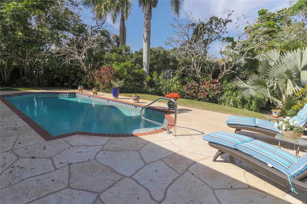 Enjoy your custom landscaped backyard an salt water pool! 