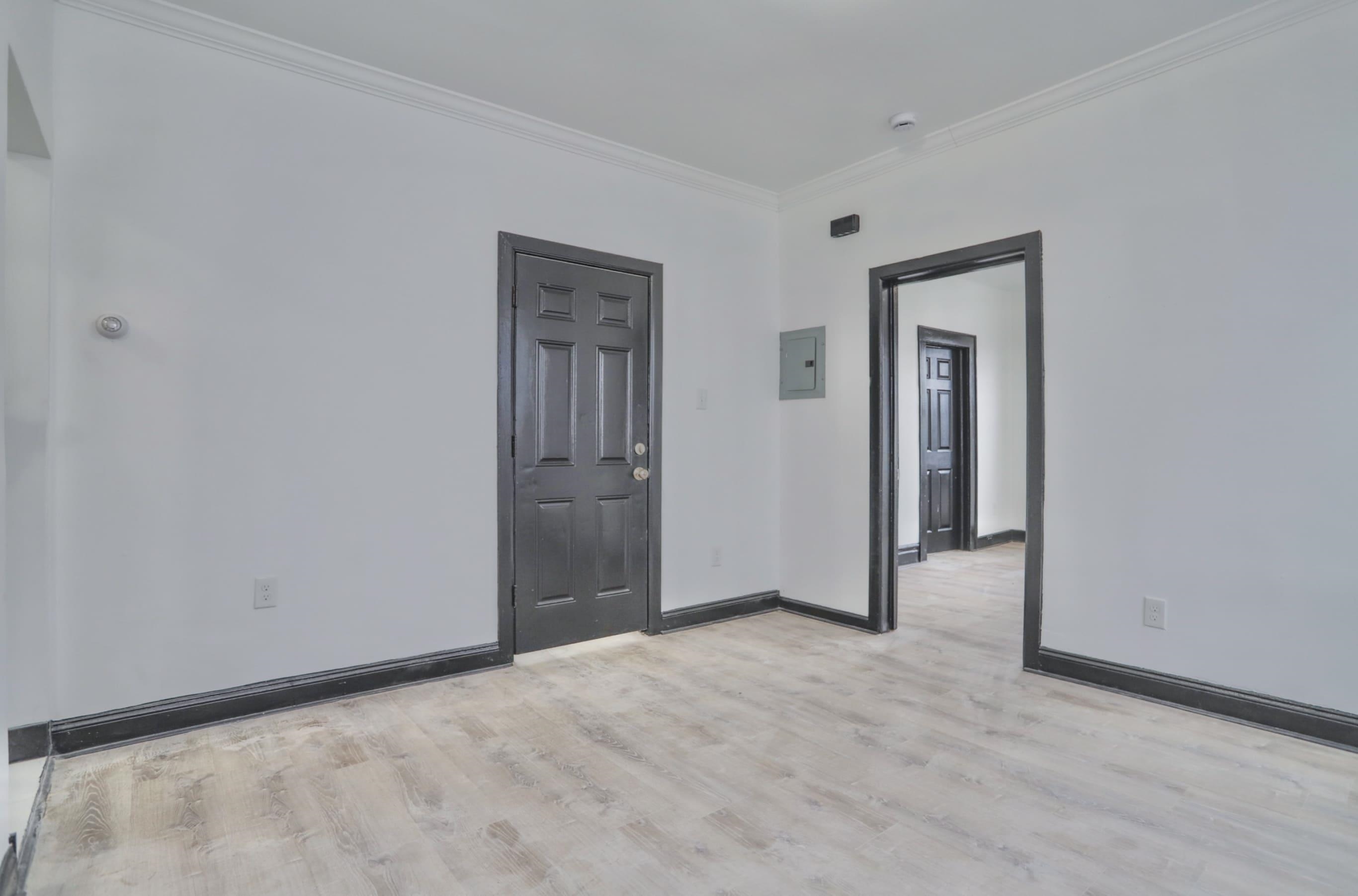 445 South 15th Street Newark, NJ 07103 - Photo 29 of 41 a view of a livingroom with wooden floor and closet