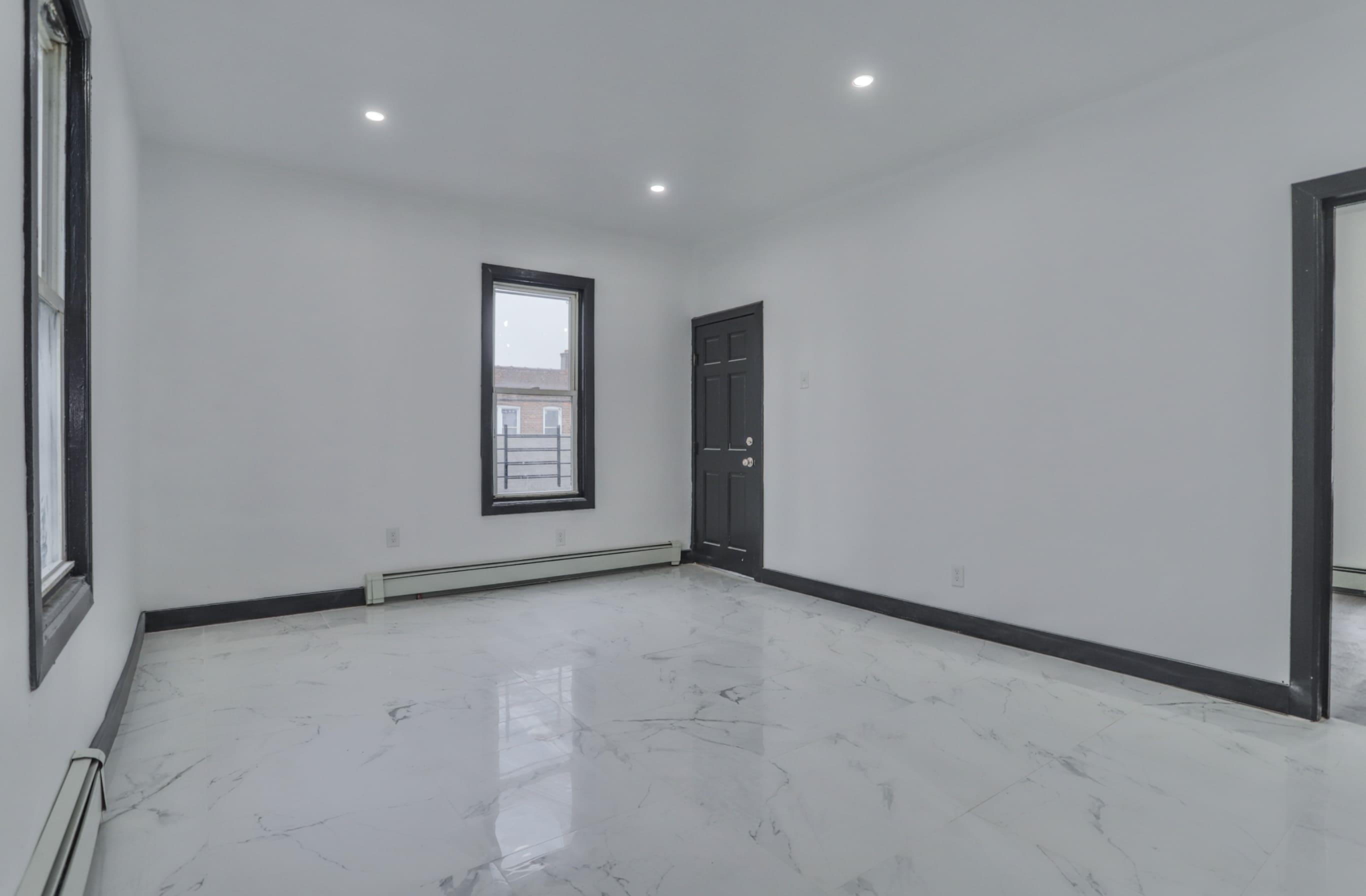 445 South 15th Street Newark, NJ 07103 - Photo 39 of 41 a view of an empty room with a window