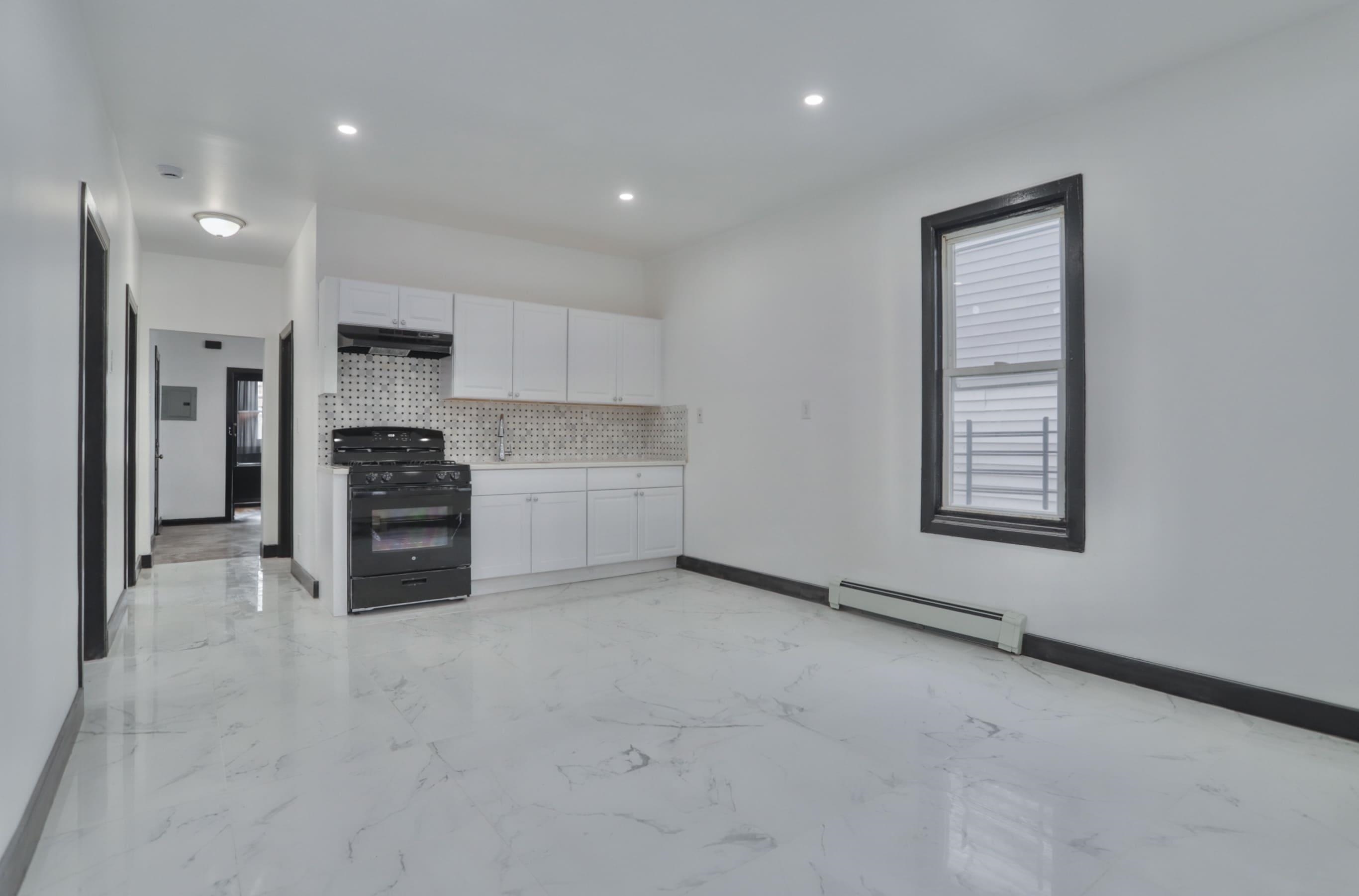 445 South 15th Street Newark, NJ 07103 - Photo 41 of 41 a kitchen with stainless steel appliances a refrigerator and a stove top oven