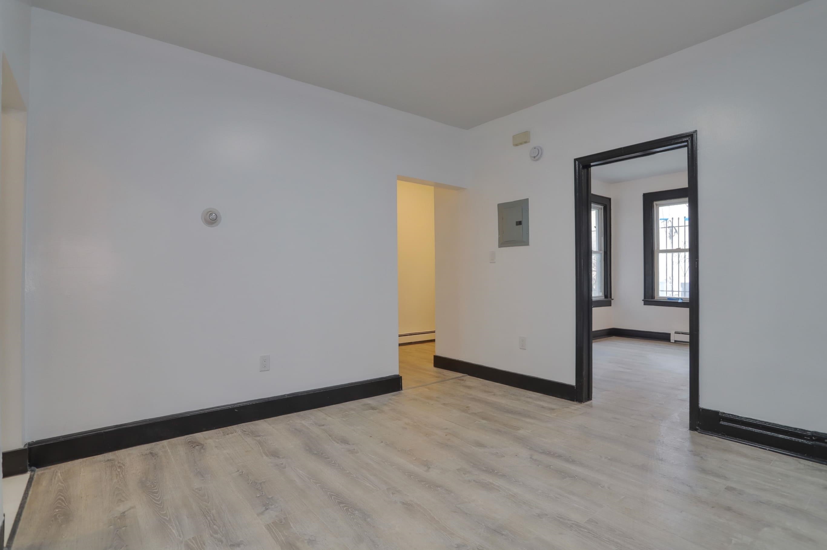 445 South 15th Street Newark, NJ 07103 - Photo 6 of 41 a view of an empty room with wooden floor
