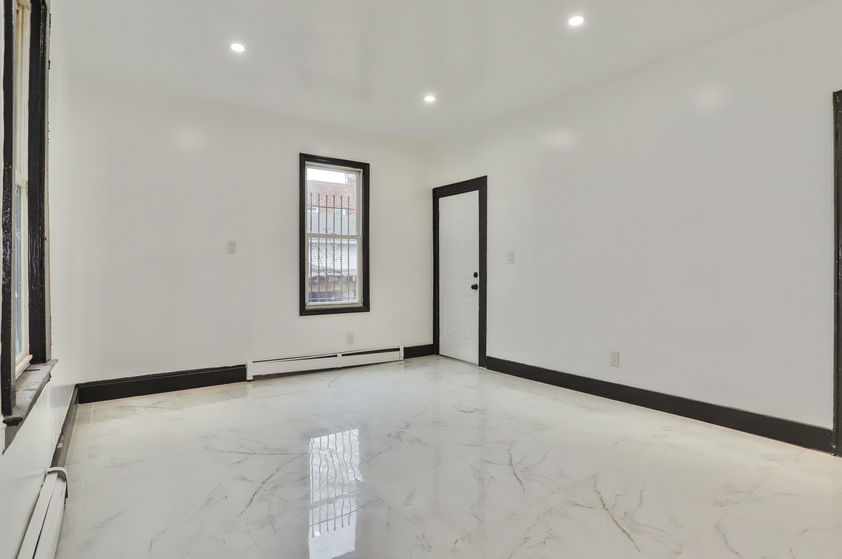 445 South 15th Street Newark, NJ 07103 - Photo 9 of 41 an empty room with windows