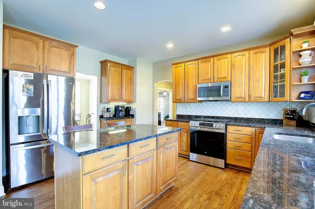 a spacious bedroom with a bed and a window