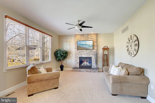 a spacious bedroom with a bed and window