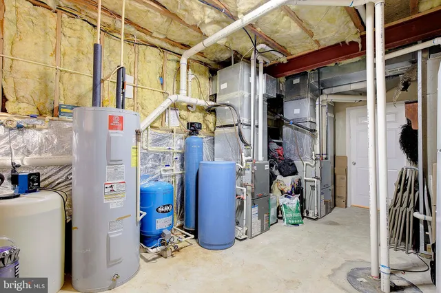 a bathroom with swimming pool and trees in the background