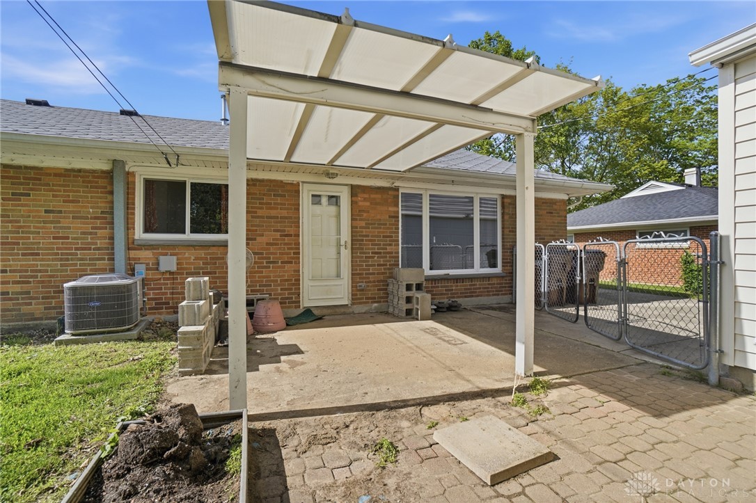 629 Storms Road Dayton, OH 45429 - Photo 48 of 51 This outdoor space offers a covered patio and a well-maintained yard.