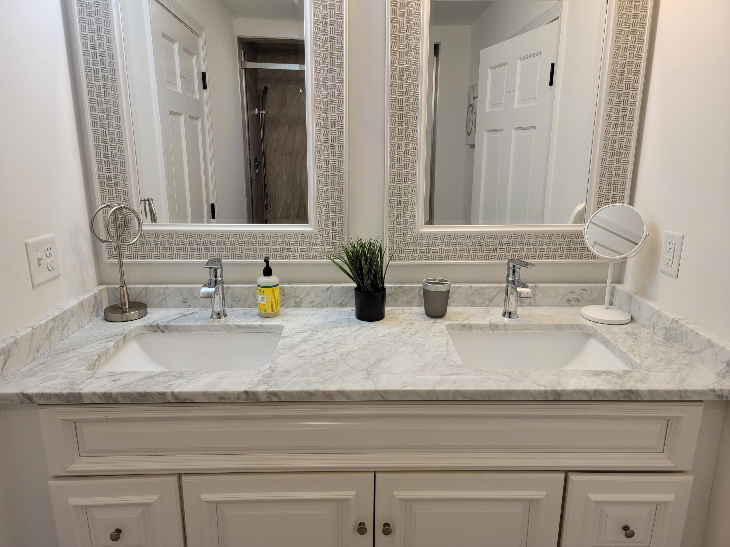1060 Craigville Beach Road Centerville, MA 02632 - Photo 13 of 50 a bathroom with sink and mirror