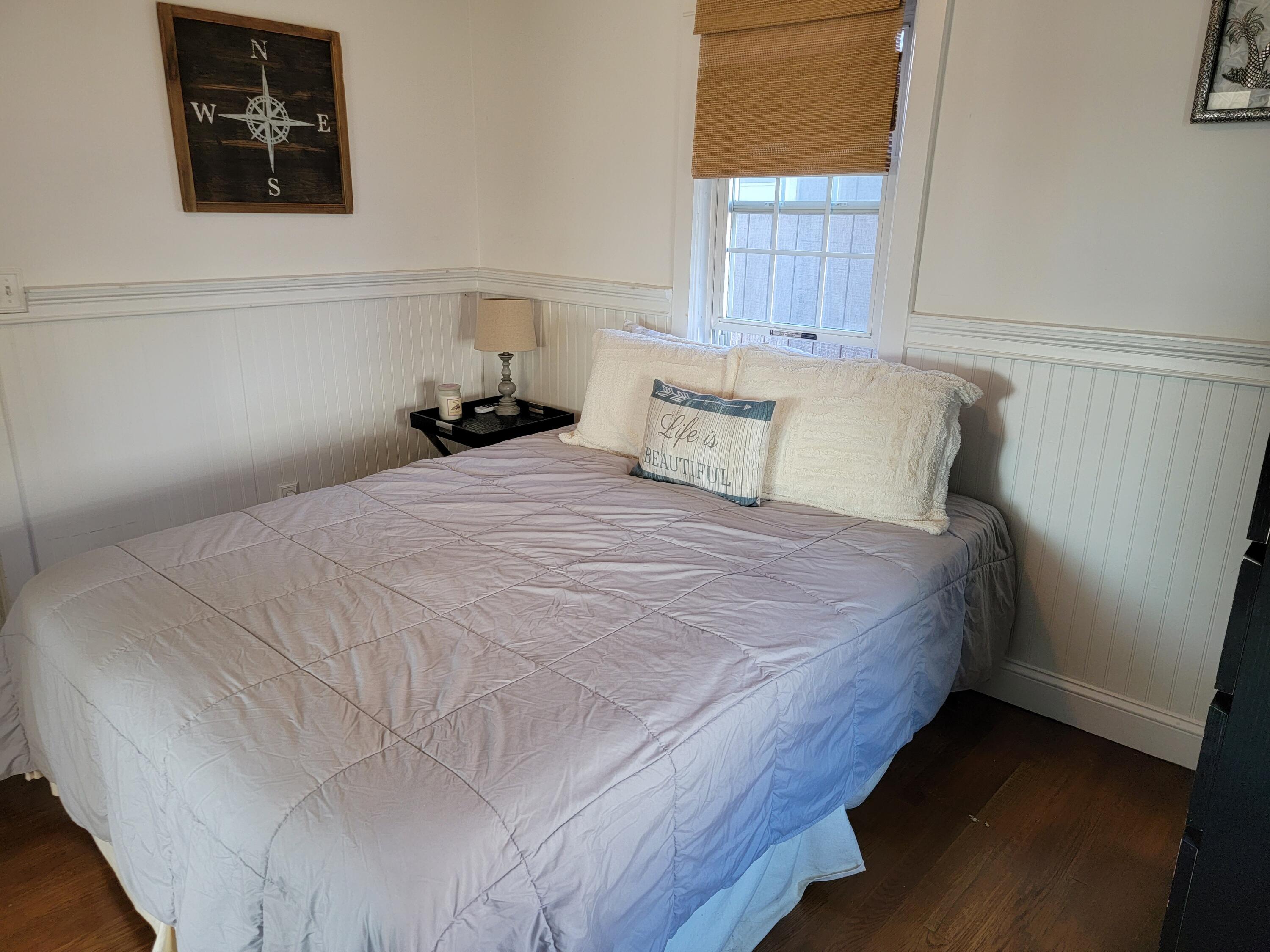 1060 Craigville Beach Road Centerville, MA 02632 - Photo 14 of 50 a bedroom with a bed and a window