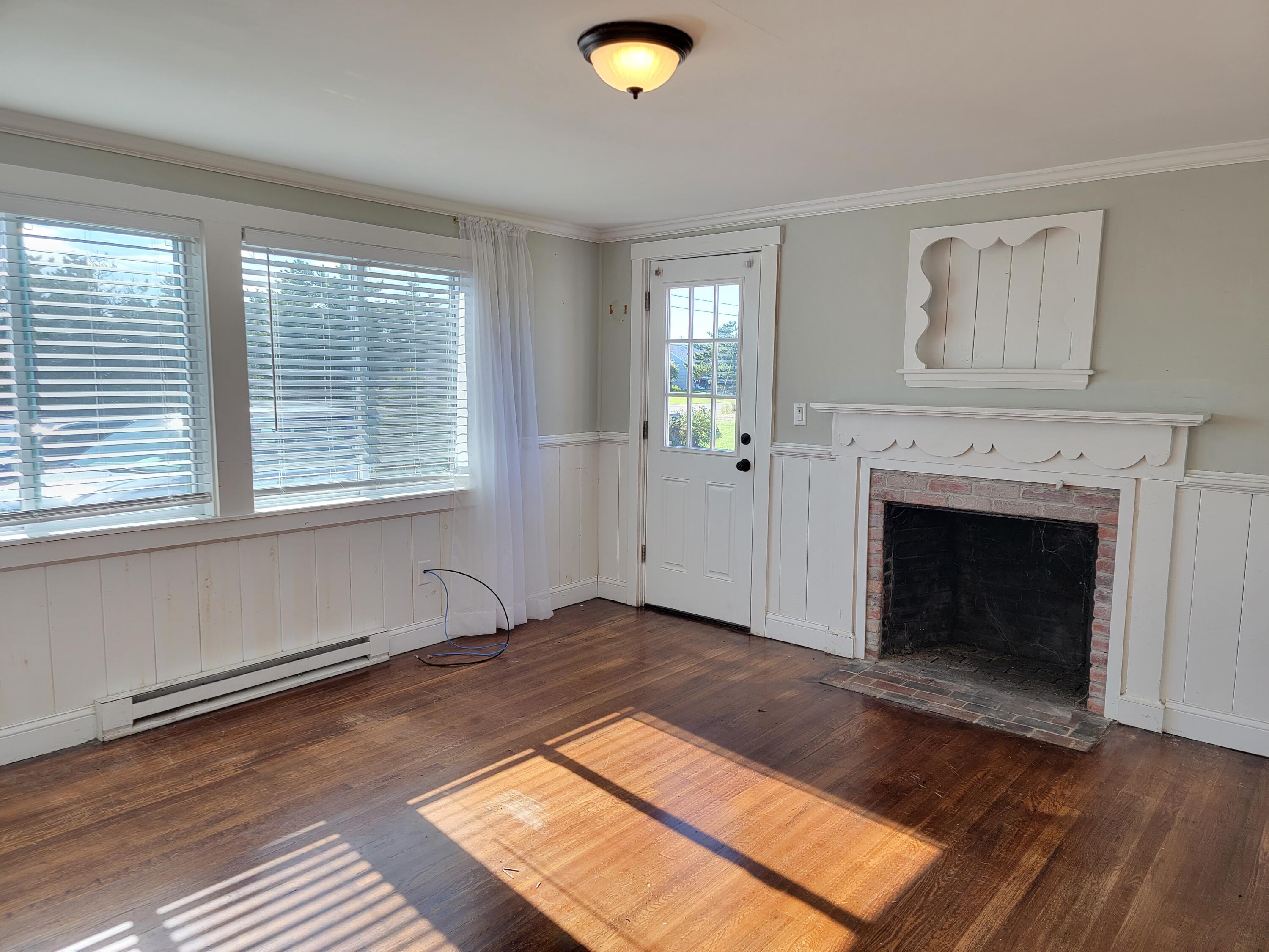 1060 Craigville Beach Road Centerville, MA 02632 - Photo 17 of 50 a view of a livingroom with a fireplace and window