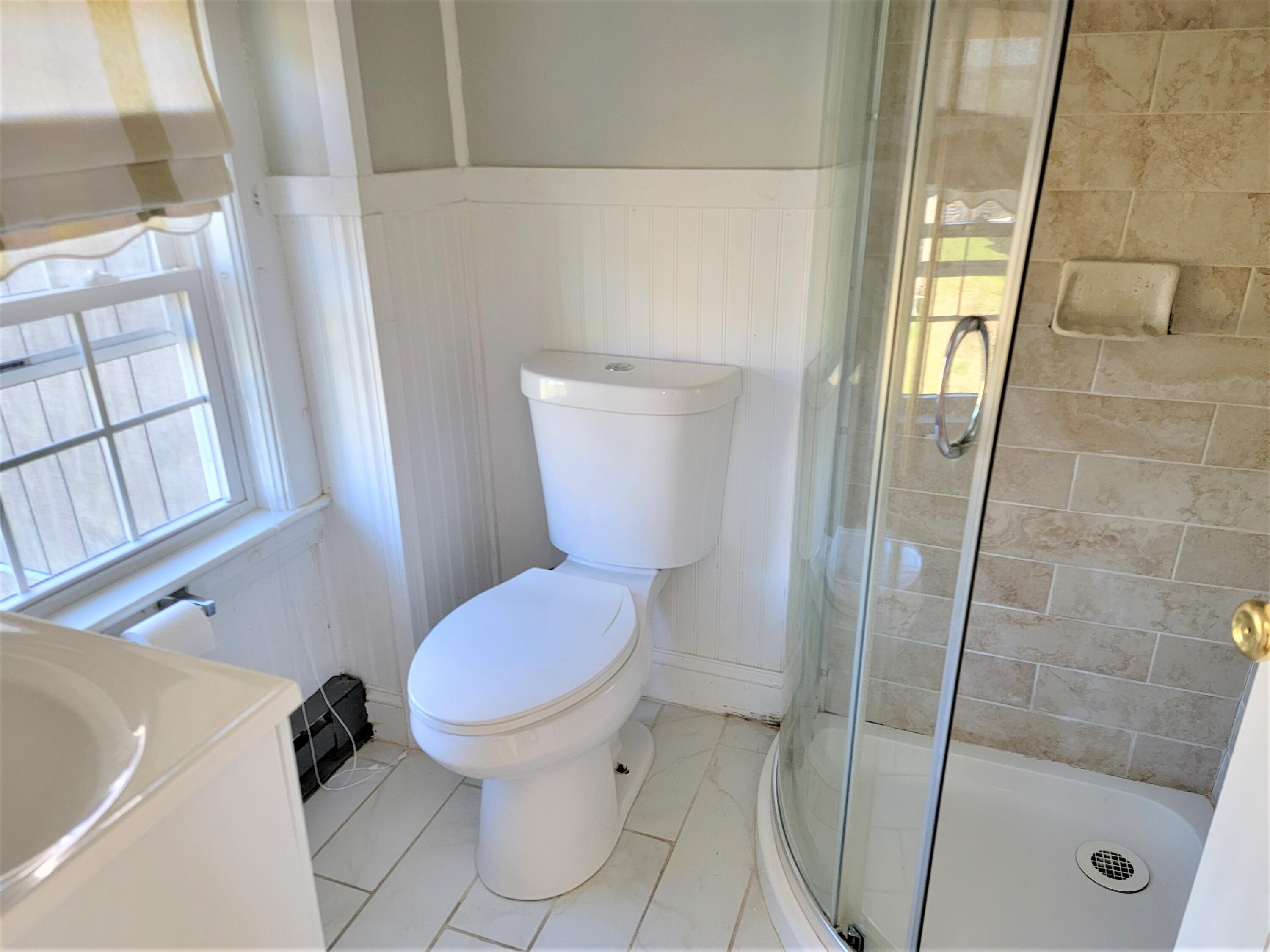 1060 Craigville Beach Road Centerville, MA 02632 - Photo 19 of 50 a bathroom with a toilet and a shower