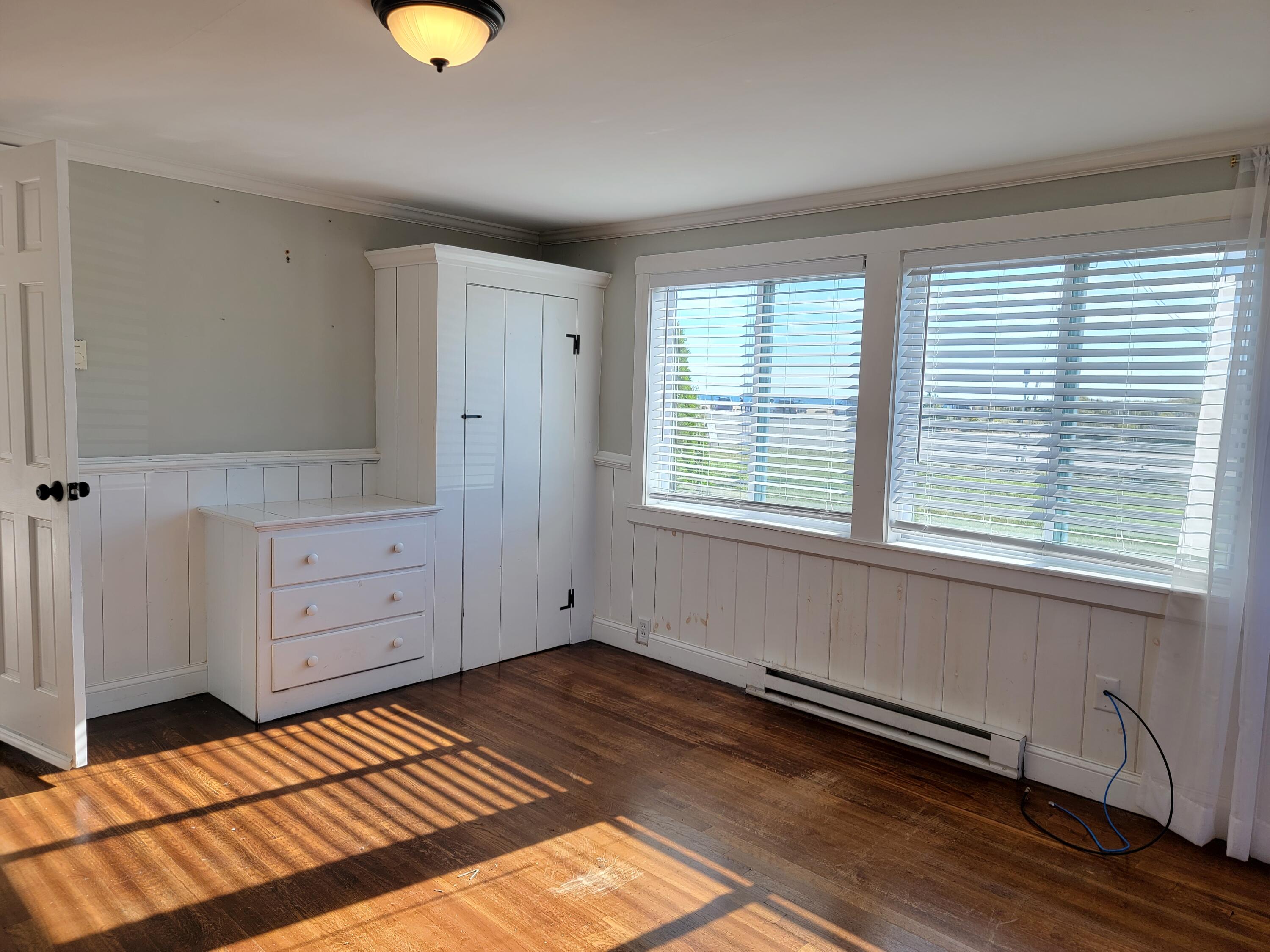 1060 Craigville Beach Road Centerville, MA 02632 - Photo 21 of 50 a bedroom with a bed and a window