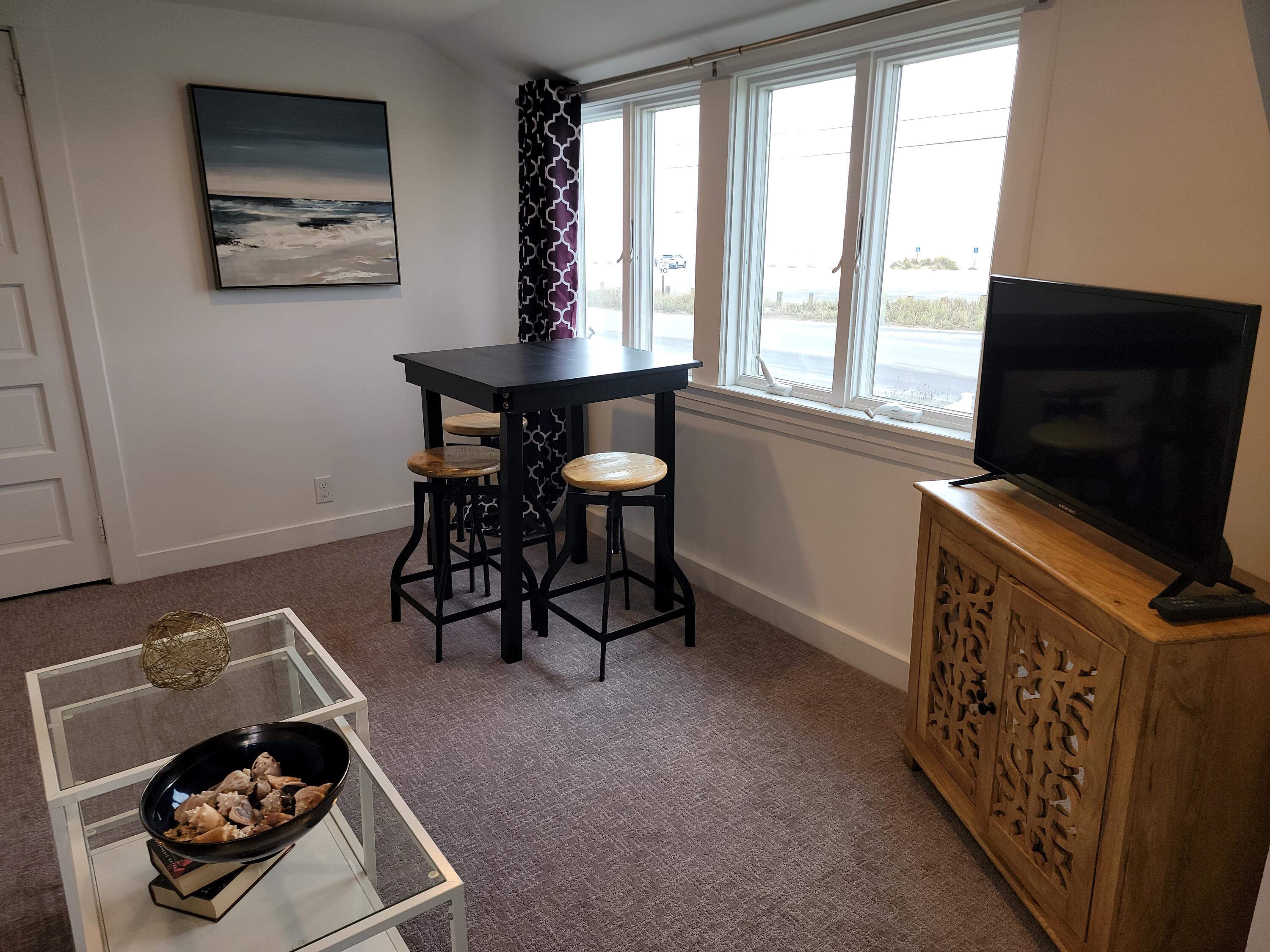 1060 Craigville Beach Road Centerville, MA 02632 - Photo 25 of 50 a room with furniture and a window