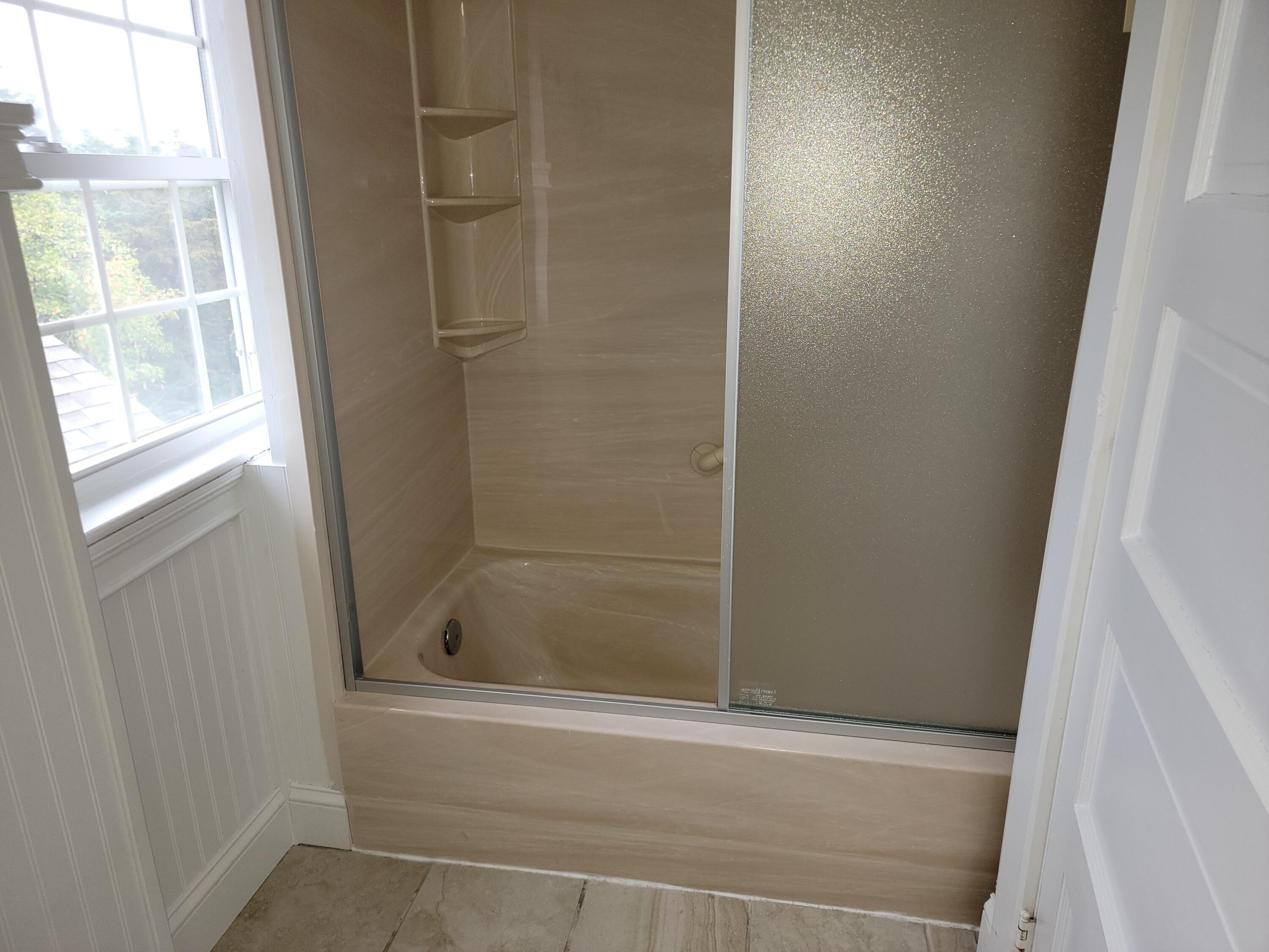 1060 Craigville Beach Road Centerville, MA 02632 - Photo 30 of 50 a bathroom with a bathtub