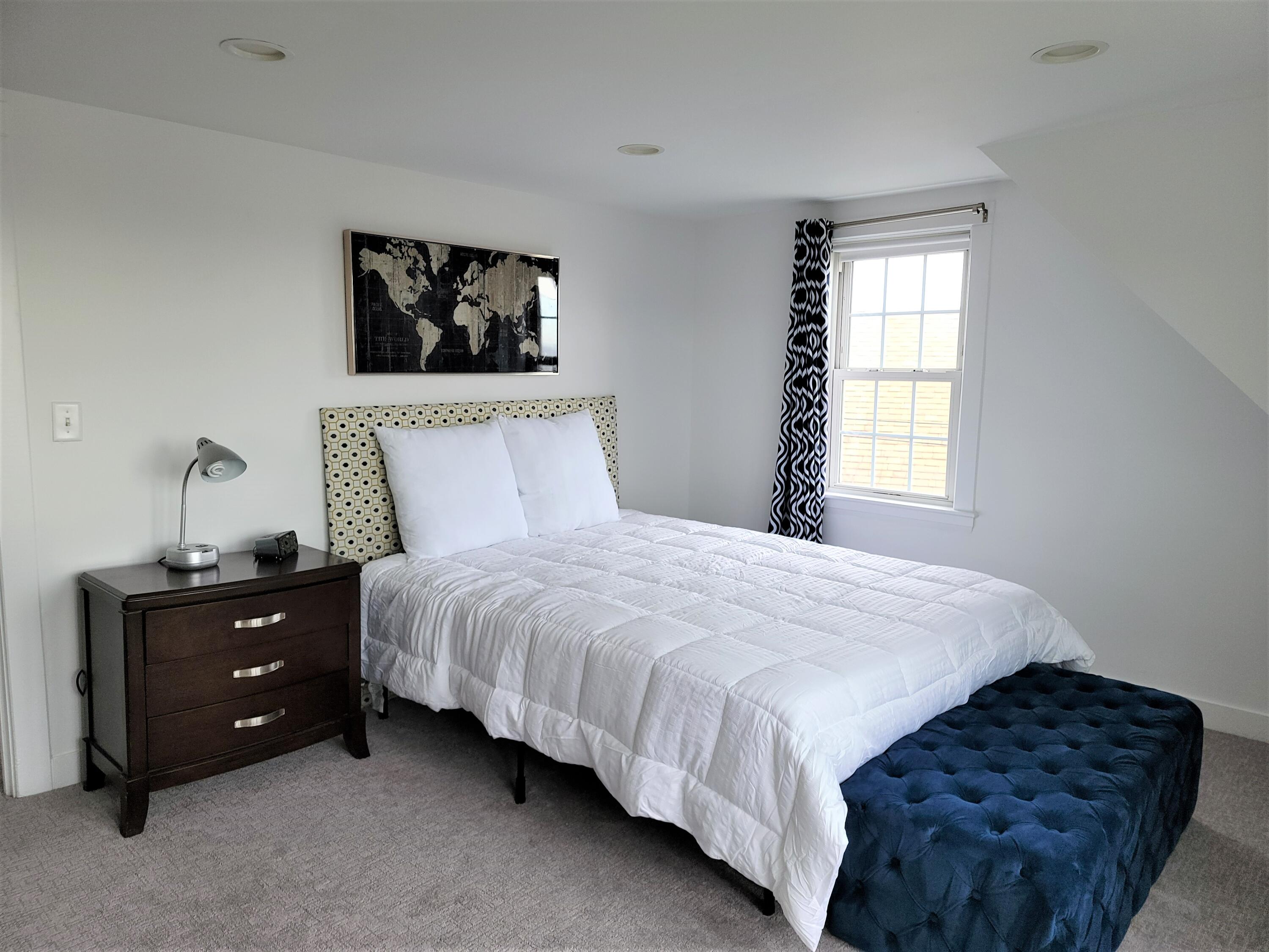 1060 Craigville Beach Road Centerville, MA 02632 - Photo 31 of 50 a bedroom with a bed and a window