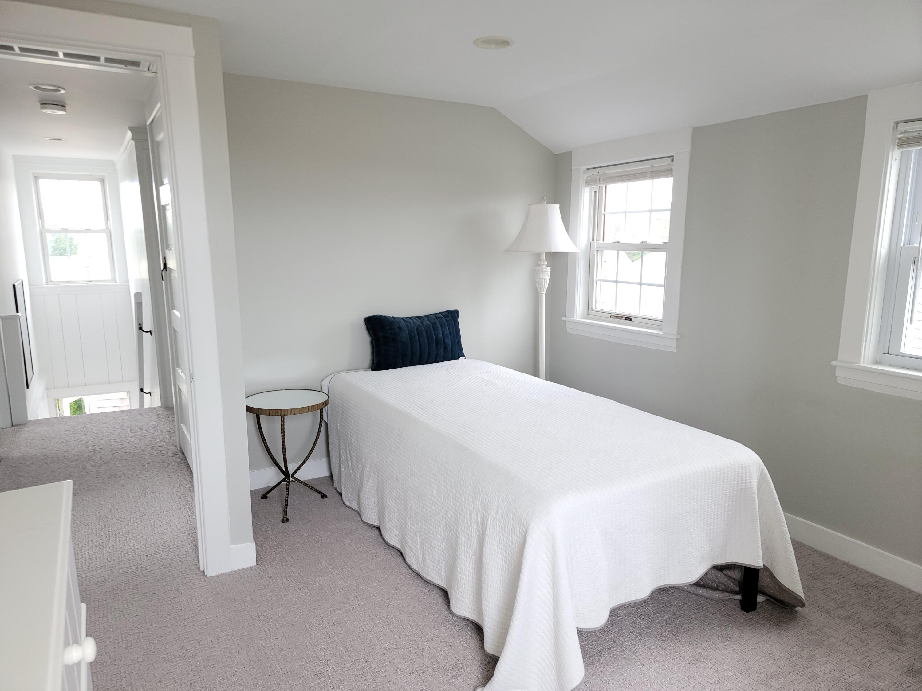 1060 Craigville Beach Road Centerville, MA 02632 - Photo 35 of 50 a bedroom with a bed and a window