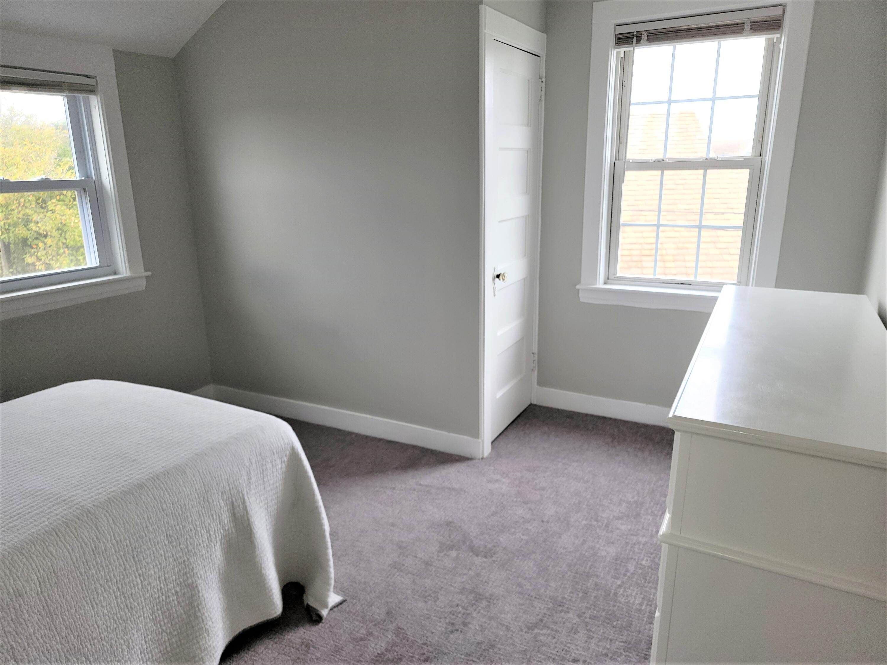 1060 Craigville Beach Road Centerville, MA 02632 - Photo 36 of 50 a bed room with a bed and a window