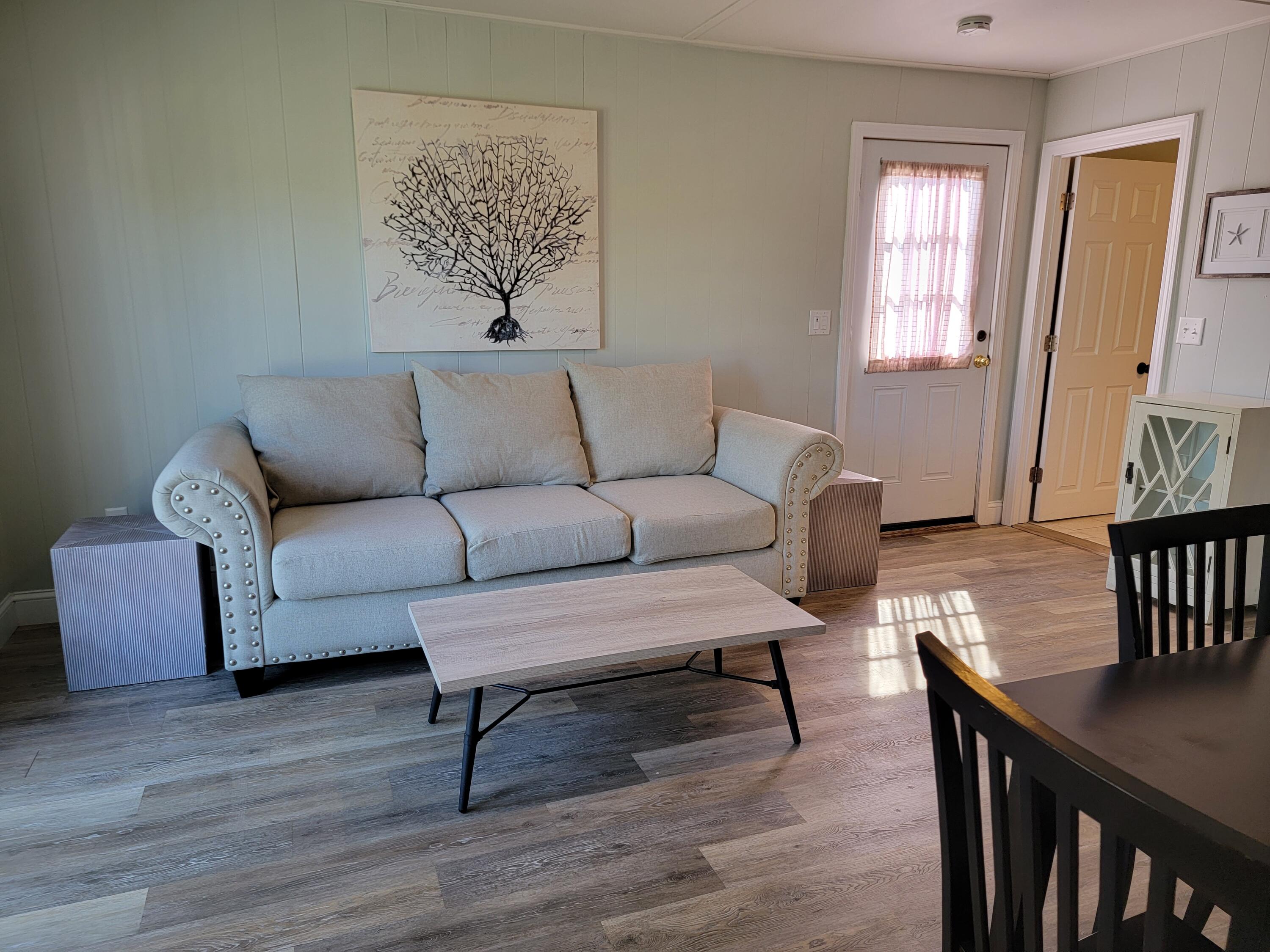 1060 Craigville Beach Road Centerville, MA 02632 - Photo 39 of 50 a living room with furniture and a window