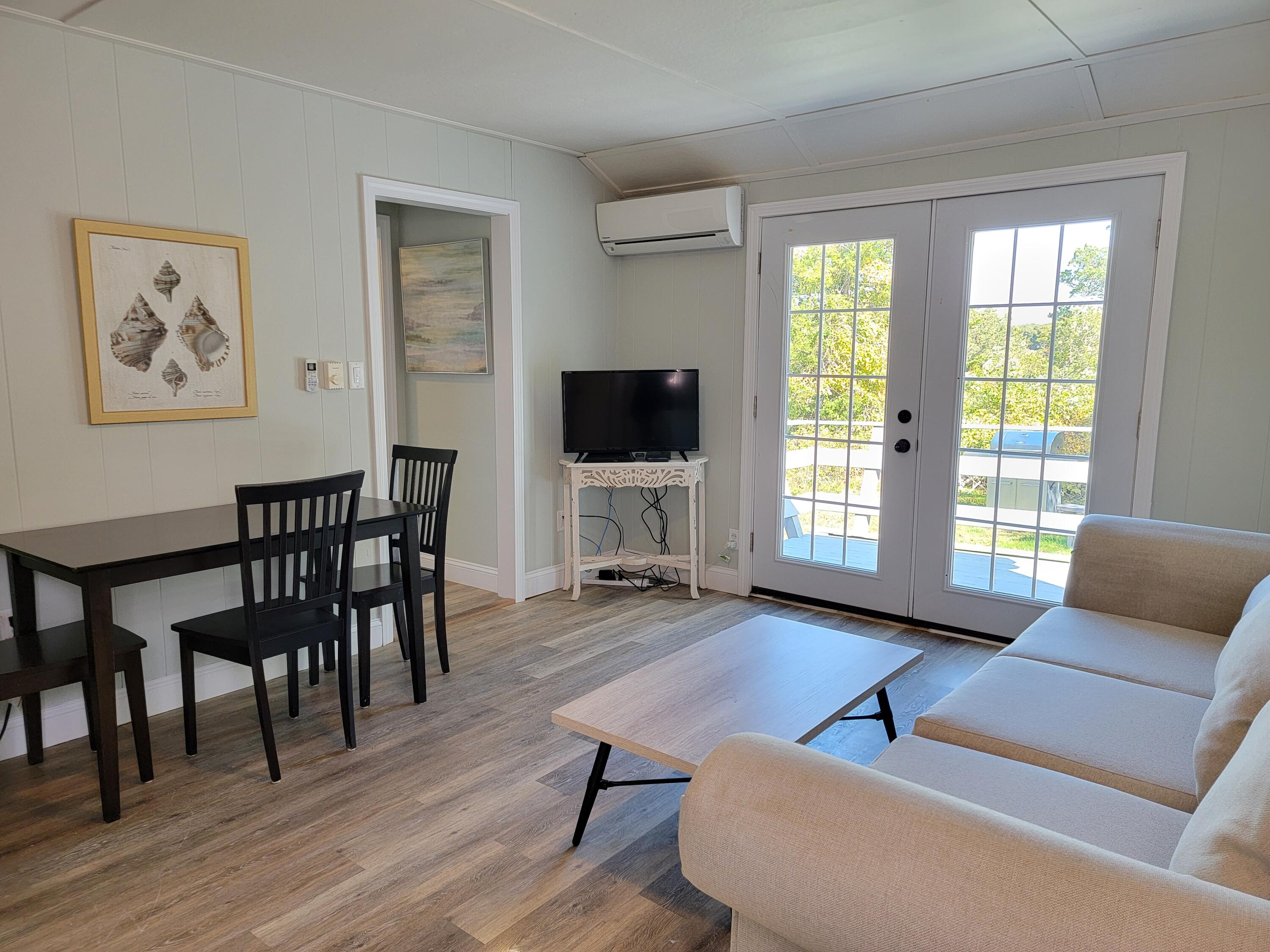 1060 Craigville Beach Road Centerville, MA 02632 - Photo 41 of 50 a living room with furniture and a flat screen tv