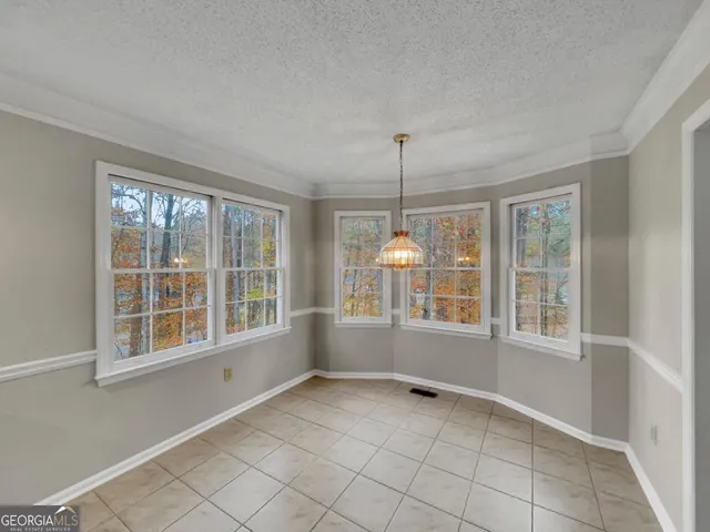a kitchen with a sink appliances and cabinets