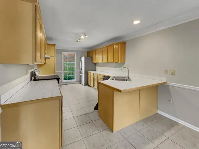 a kitchen with a sink and cabinets
