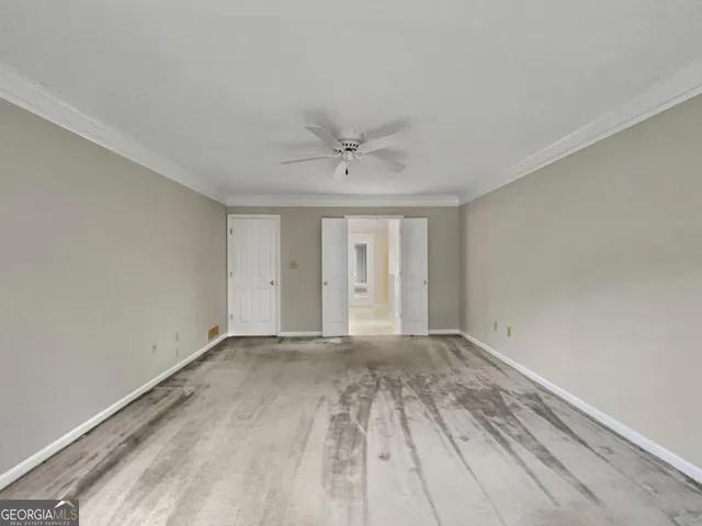 a spacious bathroom with a double vanity sink toilet mirror and bathtub