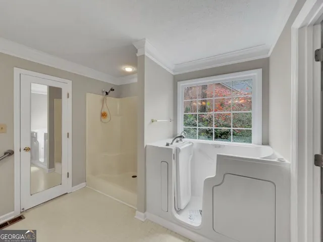 a view of a bathroom with tub