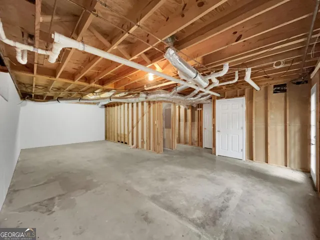 a view of a room with wooden walls