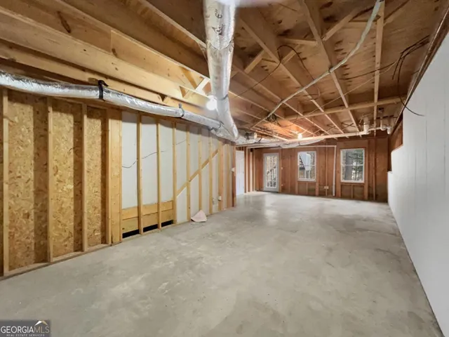 a view of balcony with wooden floor and fence